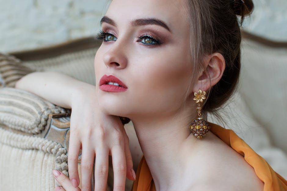 Stunning close-up portrait of a woman with elegant makeup and jewelry, epitomizing modern fashion and beauty