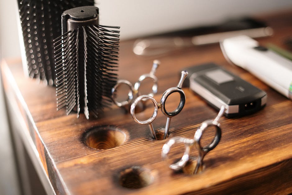 Close-up of barber tools on a stylish wooden counter, perfect for a salon setting